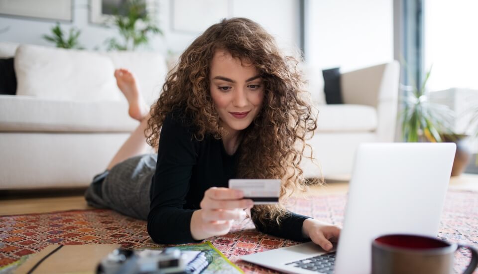 woman with credit card browsing an optimized ecommerce category page
