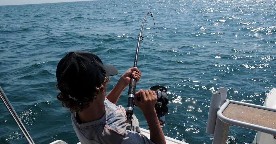 man fishing to represent customer acquisition channels