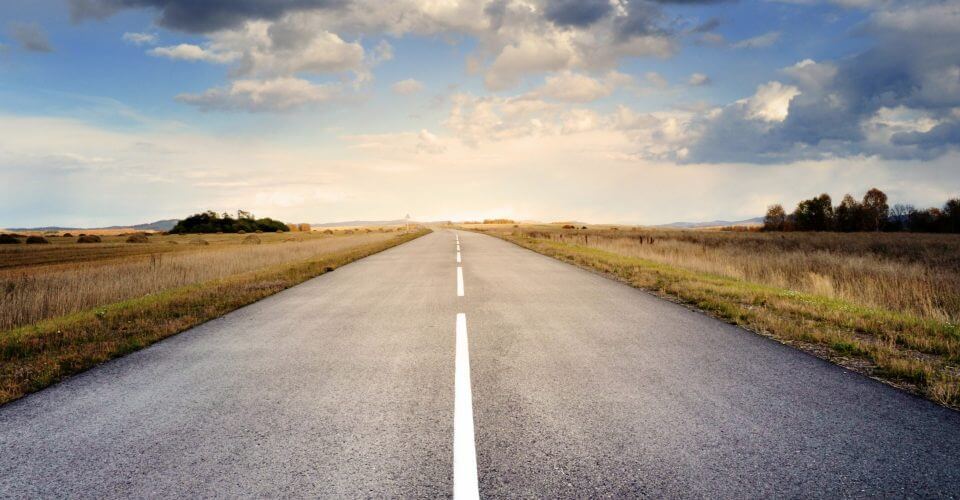 long road vanishing in horizon to demonstrate how lead generation takes a long time