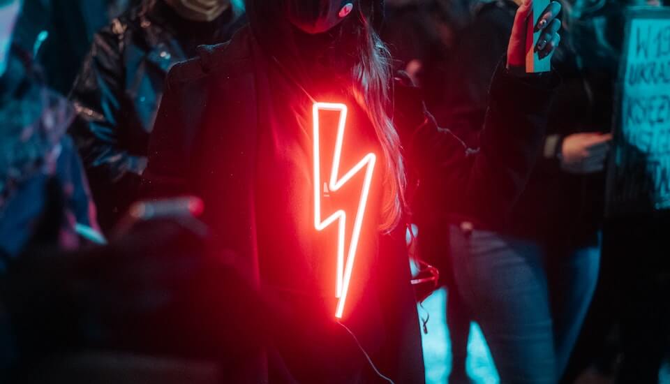 person with a glowing red lightning bolt shirt