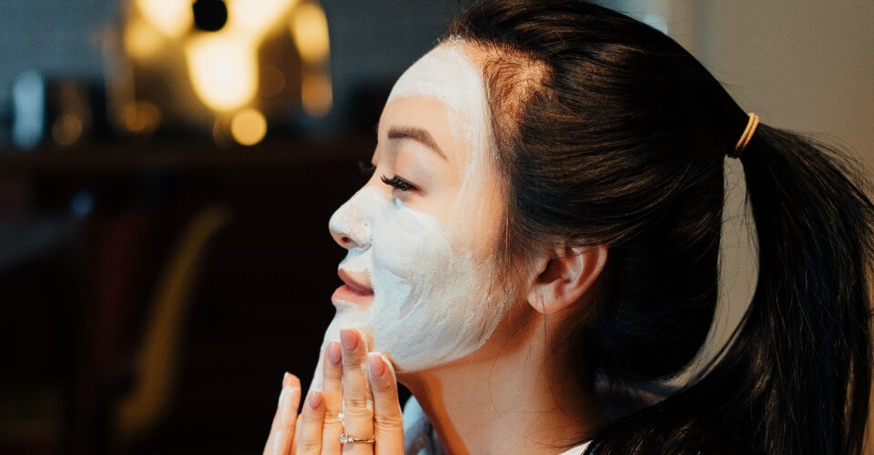 woman wearing a facial beauty mask