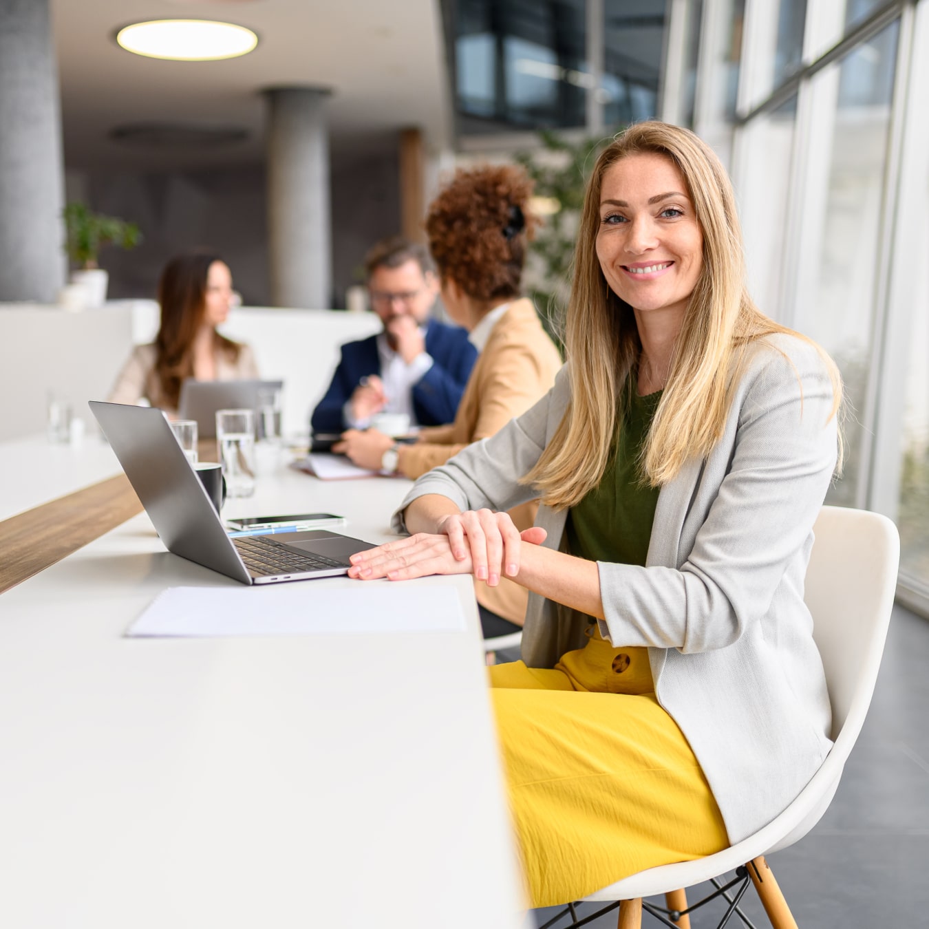 Smiling woman sitting at computer