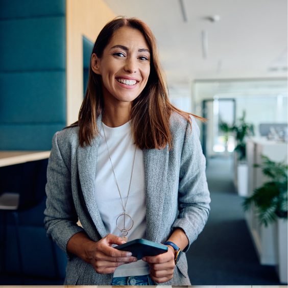 smiling woman holding a cell phone